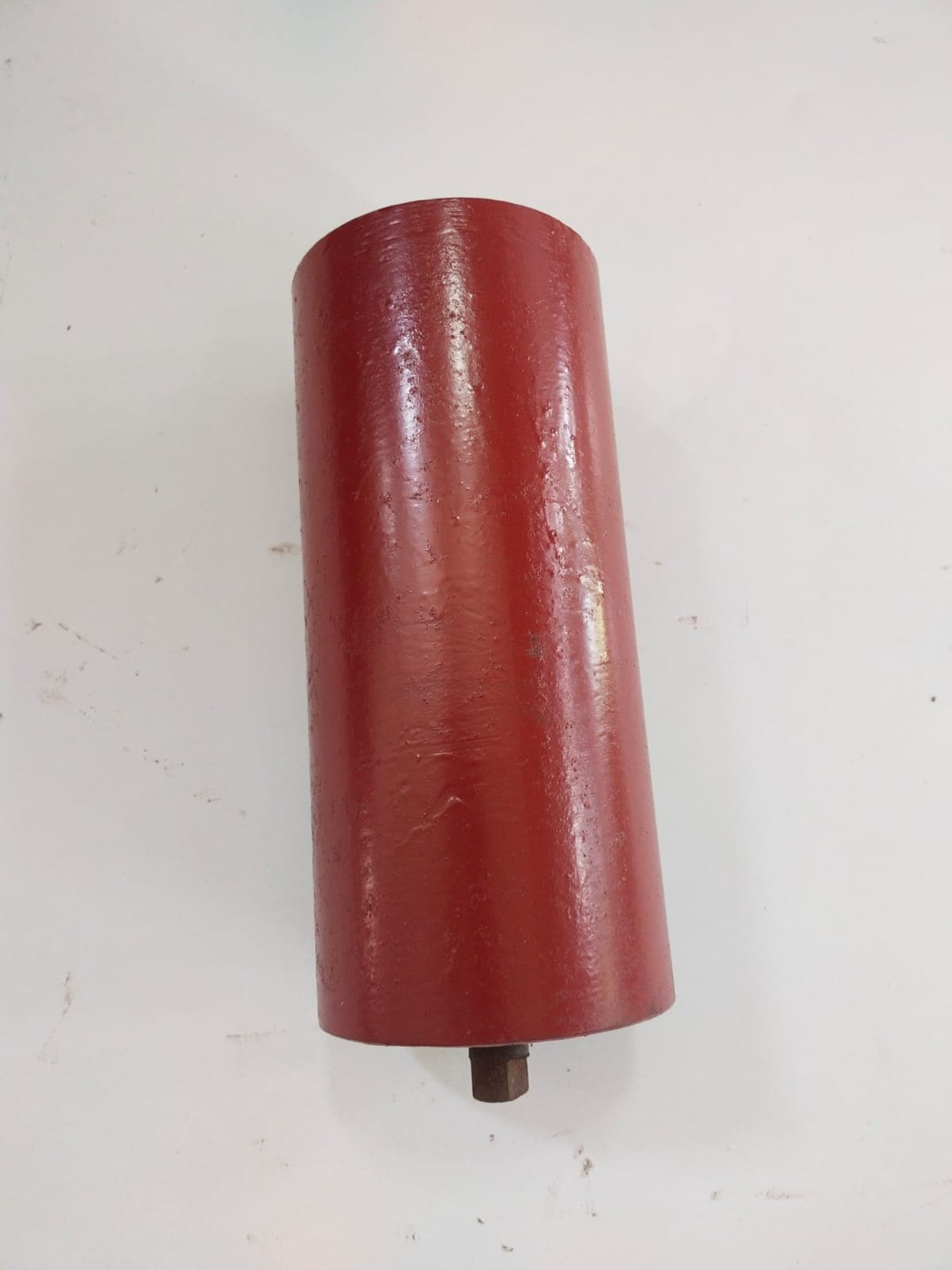 Heavy-duty red-painted conveyor roller