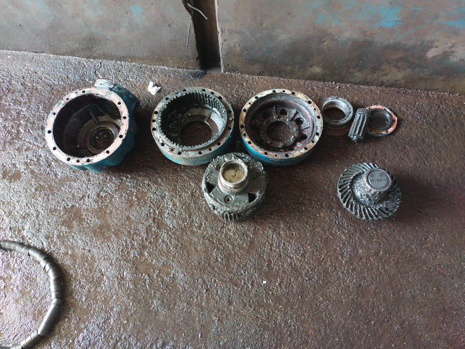 Disassembled gearbox with ring gear, differential, and planetary components