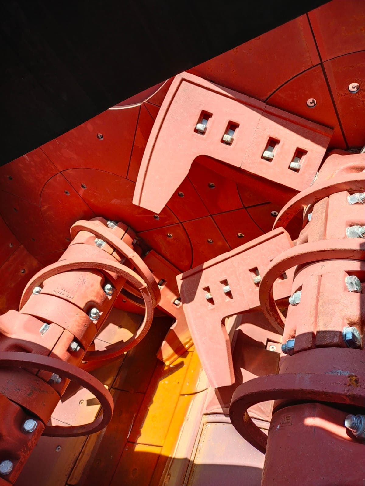 Vertical view of twin-shaft mixer paddles and scraper arms